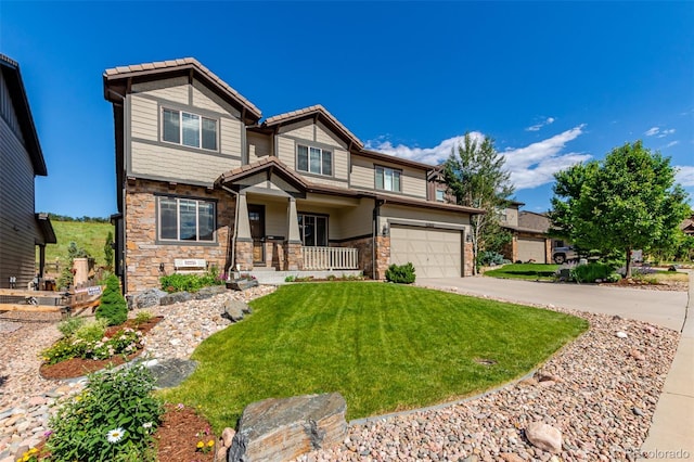 15647 Weaver Gulch Dr, Morrison, CO 80465 - craftsman-style house with driveway, an attached garage, a front yard, stone siding, and a porch