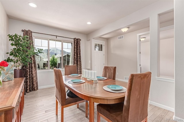 15647 Weaver Gulch Dr, Morrison, CO 80465 - dining space featuring light wood-style flooring and recessed lighting