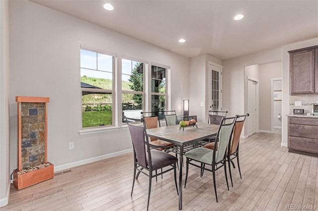 15647 Weaver Gulch Dr, Morrison, CO 80465 - dining space with light wood-type flooring, healthy amount of natural light, and recessed lighting