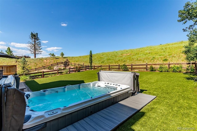 15647 Weaver Gulch Dr, Morrison, CO 80465 - deck featuring a covered hot tub, a fenced backyard, and a view of countryside