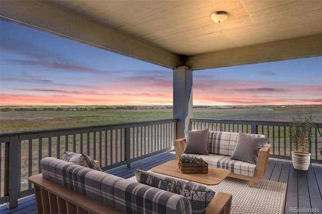 deck at dusk with a rural view