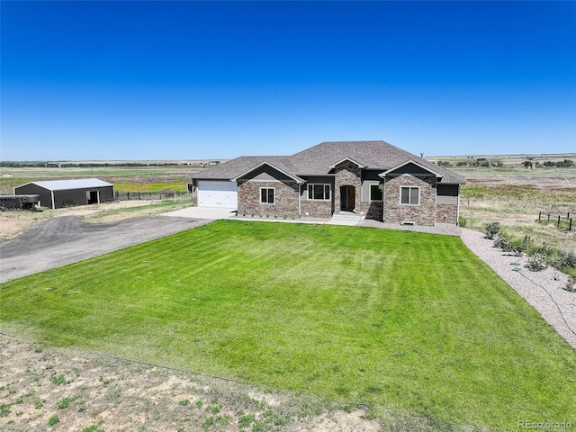 view of front of house featuring a front yard and a rural view