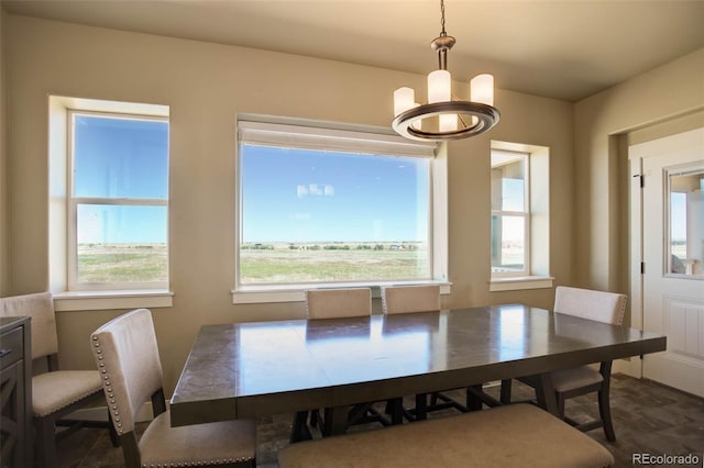 dining space with an inviting chandelier