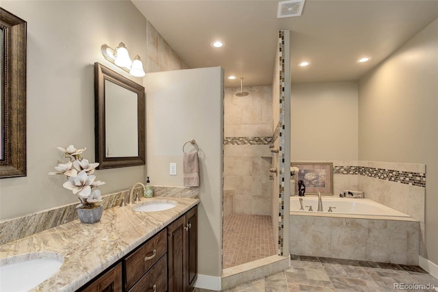 bathroom featuring vanity and separate shower and tub