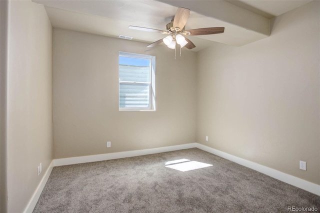 carpeted spare room featuring ceiling fan