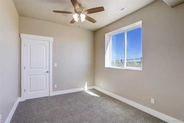 carpeted empty room with ceiling fan