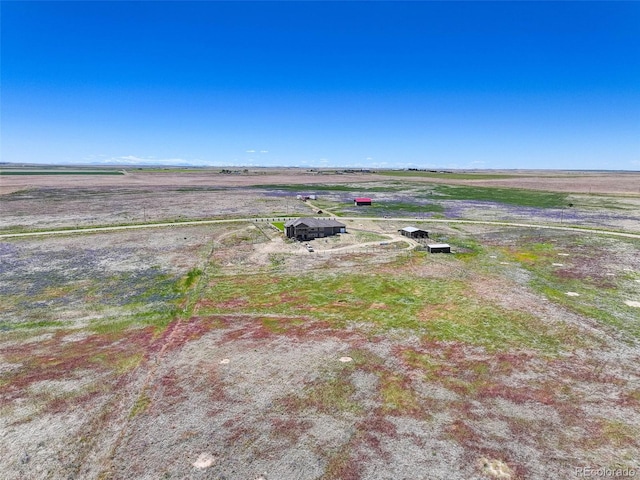 birds eye view of property featuring a rural view