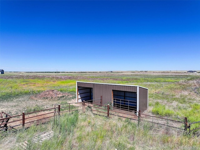 view of outbuilding with a rural view