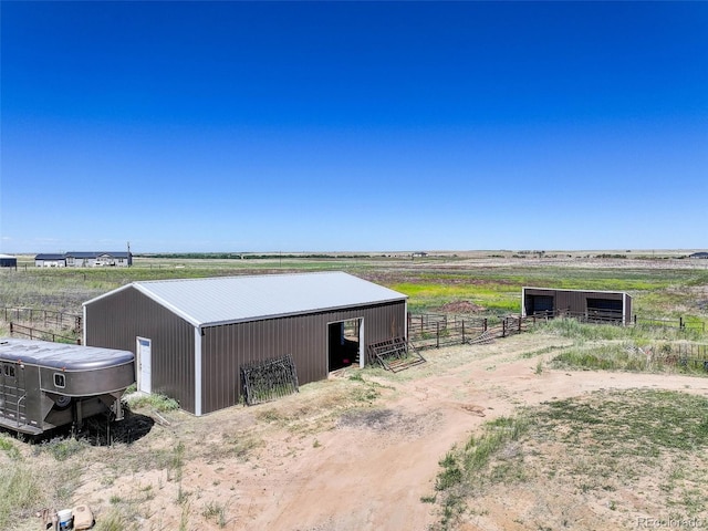 view of outbuilding featuring a rural view