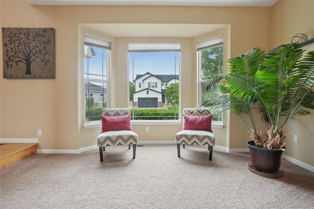 9158 Forest St, Firestone, CO 80504 - sitting room with plenty of natural light, carpet flooring, and baseboards
