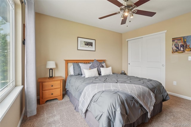 9158 Forest St, Firestone, CO 80504 - carpeted bedroom with a closet, baseboards, and ceiling fan