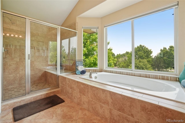 9158 Forest St, Firestone, CO 80504 - bathroom featuring a garden tub, a shower stall, lofted ceiling, and tile patterned floors