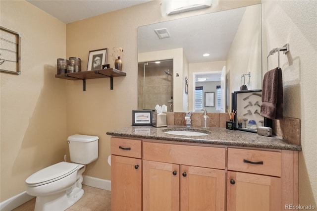 9158 Forest St, Firestone, CO 80504 - full bath with toilet, vanity, a tile shower, tile patterned flooring, and baseboards