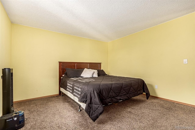 carpeted bedroom featuring baseboards and a textured ceiling