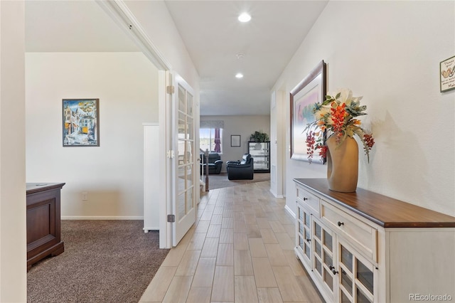 hall with recessed lighting, french doors, and baseboards