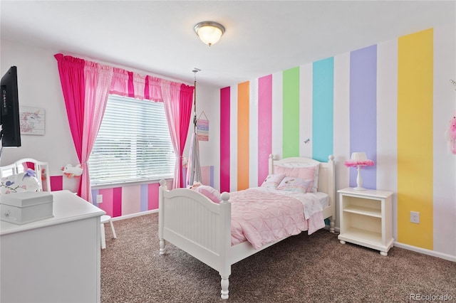 carpeted bedroom with baseboards