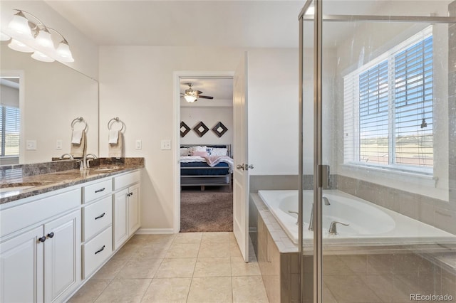 full bathroom with a sink, plenty of natural light, ensuite bath, and tile patterned floors