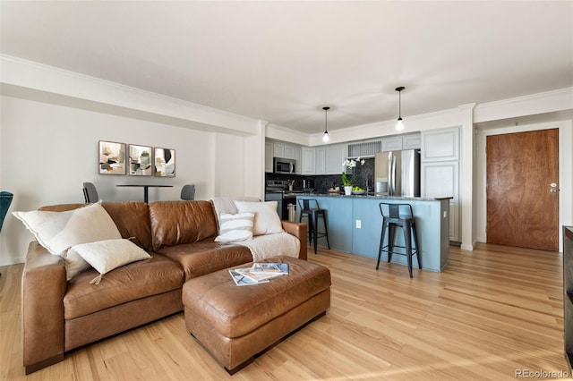 601 W 11th Ave Unit 910, Denver, CO 80204 - living area with ornamental molding and light wood finished floors