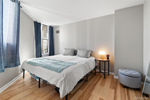 601 W 11th Ave Unit 910, Denver, CO 80204 - bedroom featuring light wood finished floors and baseboards