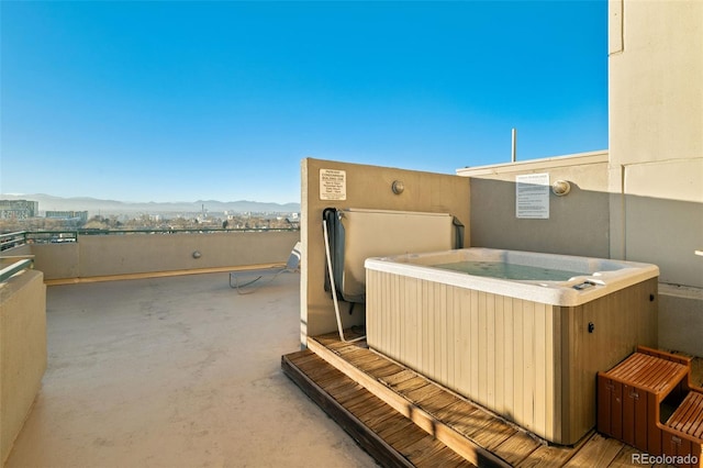 601 W 11th Ave Unit 910, Denver, CO 80204 - view of patio featuring a hot tub and a mountain view