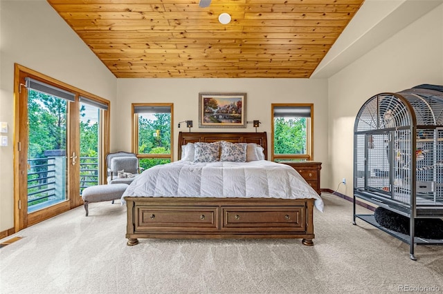 17995 Minglewood Trl, Monument, CO 80132 - bedroom featuring light colored carpet, lofted ceiling, access to exterior, multiple windows, and wood ceiling