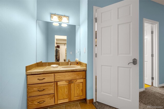 17995 Minglewood Trl, Monument, CO 80132 - bathroom with vanity and baseboards