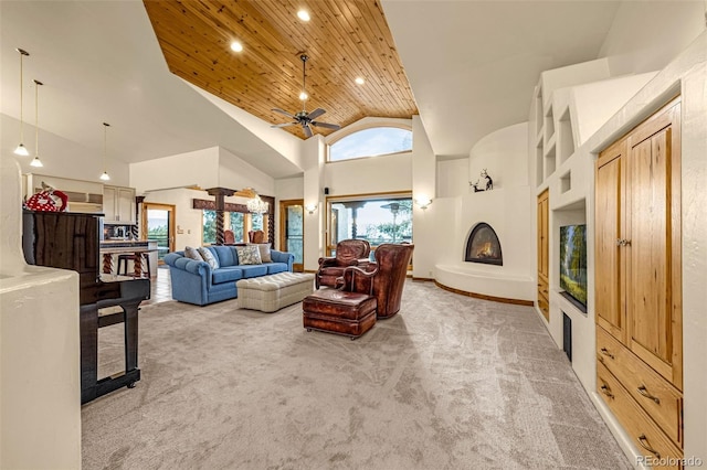 17995 Minglewood Trl, Monument, CO 80132 - living room with light colored carpet, high vaulted ceiling, a ceiling fan, a fireplace, and wooden ceiling