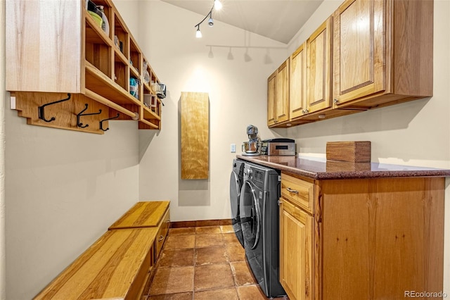 17995 Minglewood Trl, Monument, CO 80132 - washroom with separate washer and dryer, rail lighting, and cabinet space