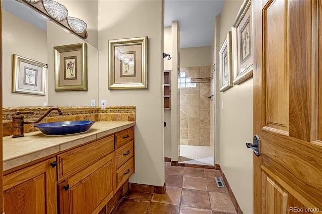 17995 Minglewood Trl, Monument, CO 80132 - bathroom featuring vanity and a tile shower