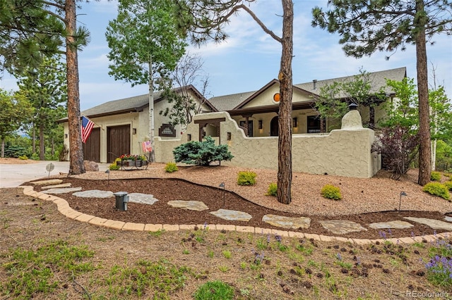 17995 Minglewood Trl, Monument, CO 80132 - view of front of home with a garage, driveway, and stucco siding