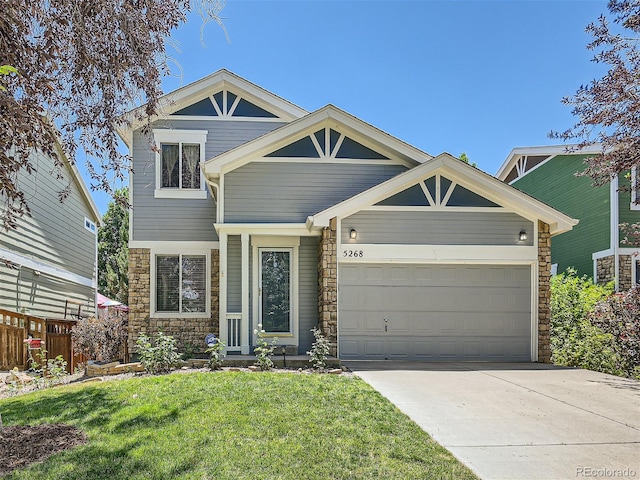 view of front facade with a front yard and a garage