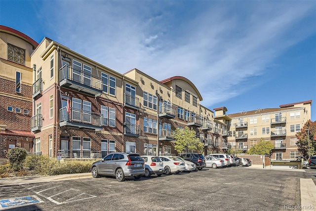 view of property featuring uncovered parking