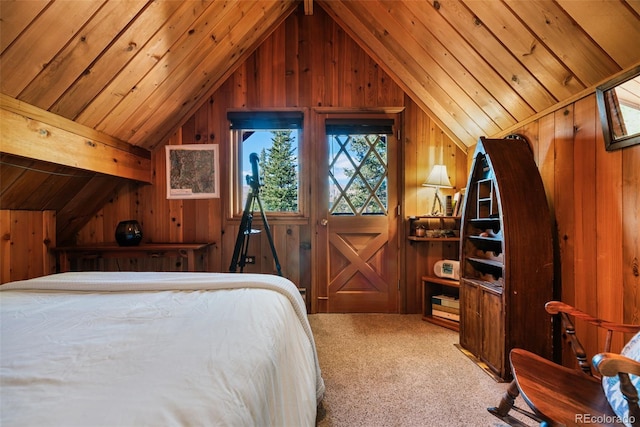 bedroom featuring wood walls, lofted ceiling with beams, and carpet