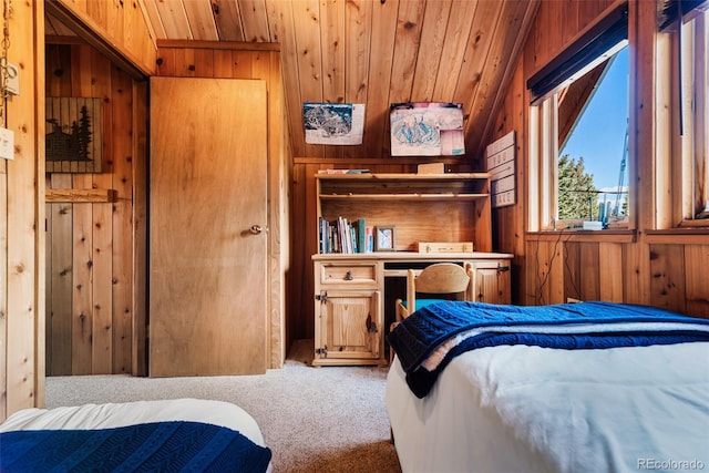 bedroom with lofted ceiling, carpet flooring, and wood walls