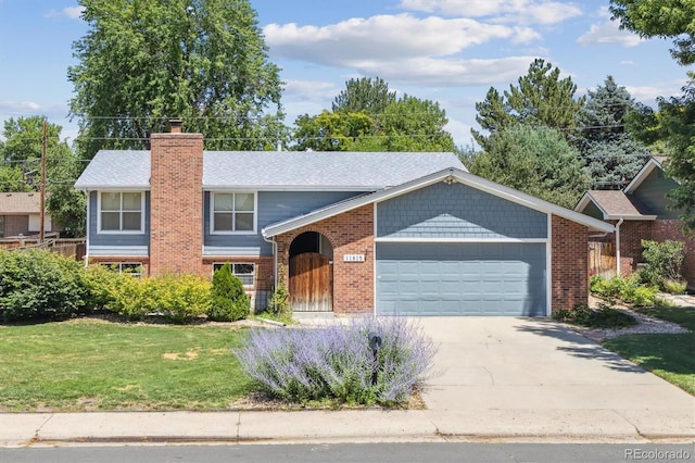 11815 E Louisiana Ave, Aurora, CO 80012 - view of front of property with an attached garage, brick siding, driveway, and a front yard