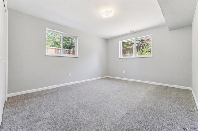 11815 E Louisiana Ave, Aurora, CO 80012 - spare room with healthy amount of natural light and carpet floors