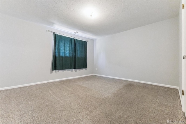 11815 E Louisiana Ave, Aurora, CO 80012 - spare room featuring carpet floors and a textured ceiling