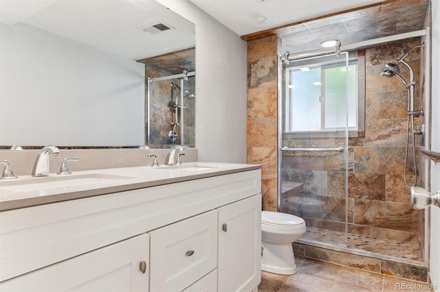 11815 E Louisiana Ave, Aurora, CO 80012 - bathroom featuring double vanity and a stall shower