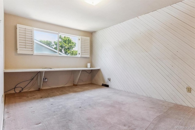 11815 E Louisiana Ave, Aurora, CO 80012 - unfurnished room with wood walls and carpet