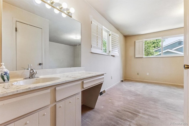 11815 E Louisiana Ave, Aurora, CO 80012 - bathroom with vanity and baseboards