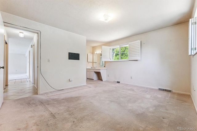 11815 E Louisiana Ave, Aurora, CO 80012 - carpeted empty room with baseboards