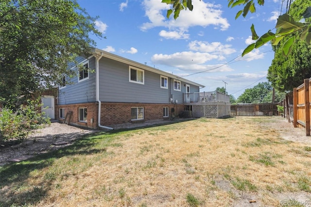 11815 E Louisiana Ave, Aurora, CO 80012 - rear view of property featuring a fenced backyard and brick siding