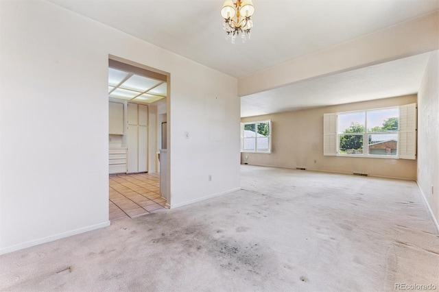 11815 E Louisiana Ave, Aurora, CO 80012 - unfurnished room with a chandelier and carpet
