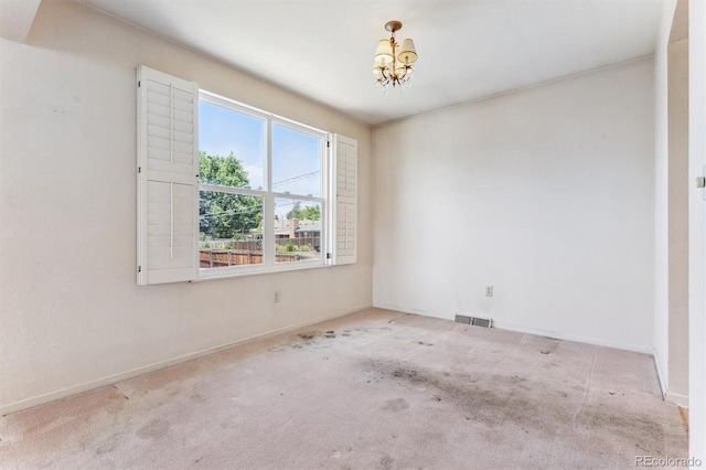 11815 E Louisiana Ave, Aurora, CO 80012 - carpeted spare room featuring a chandelier and baseboards