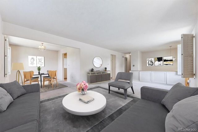 11815 E Louisiana Ave, Aurora, CO 80012 - living room with a chandelier and carpet floors