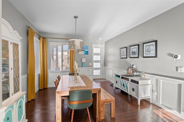 dining space with dark hardwood / wood-style floors