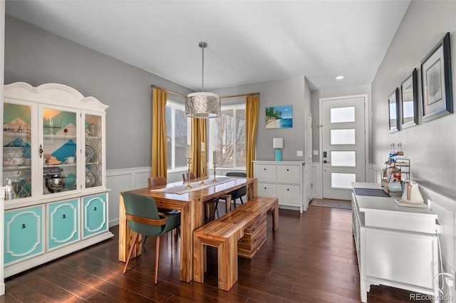 dining space featuring dark wood-type flooring