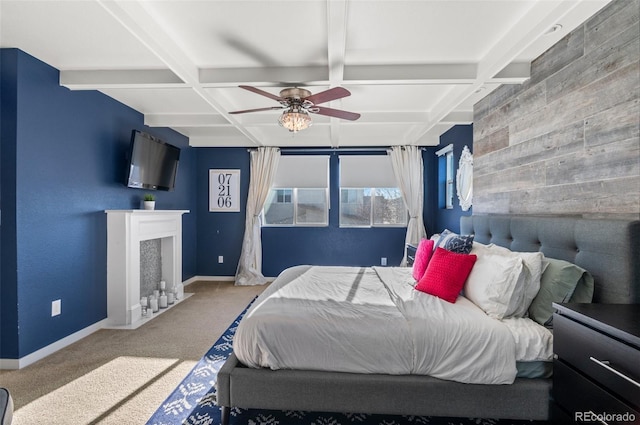 bedroom with coffered ceiling, beam ceiling, and carpet flooring