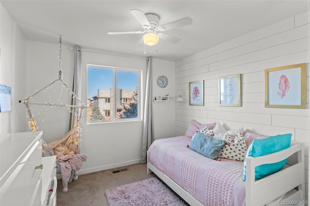 bedroom featuring light carpet and ceiling fan