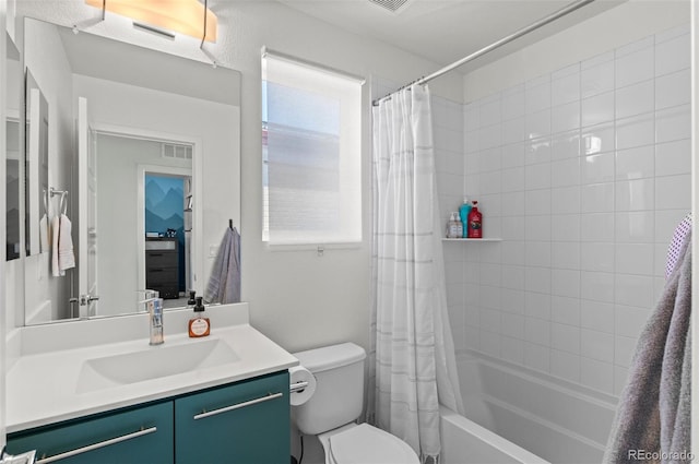 full bathroom with vanity, toilet, and shower / bath combo with shower curtain